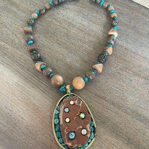 Necklace with gems and crystals